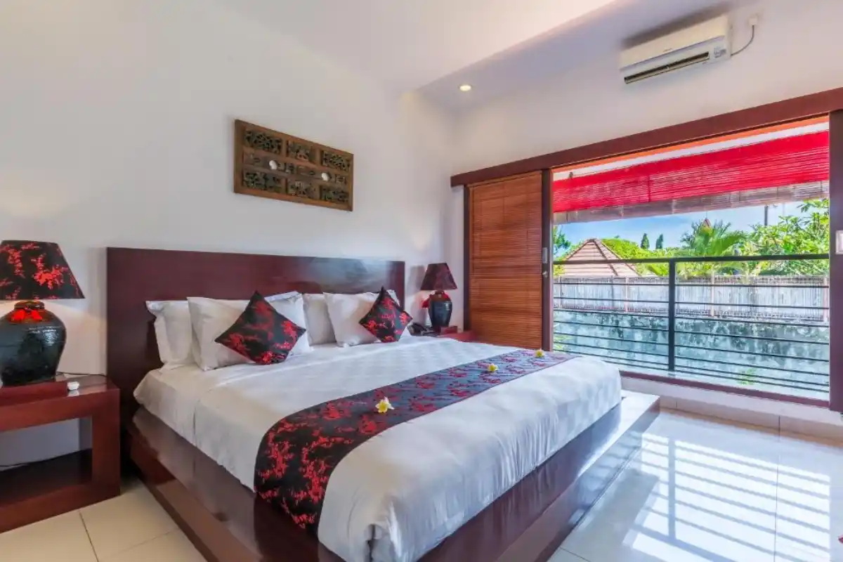 modern boutique hotel bedroom with balcony and tropical view