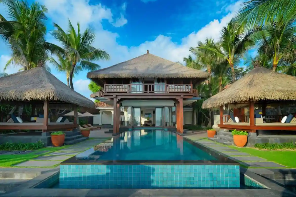 luxury tropical villa with private pool and thatched roofs